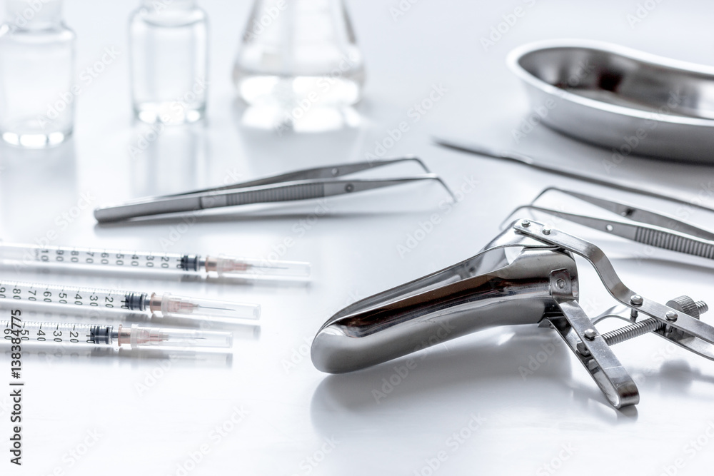instruments of gynecologist on white background instruments of gynecologist on white background