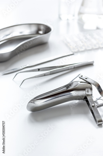 instruments of gynecologist on white background