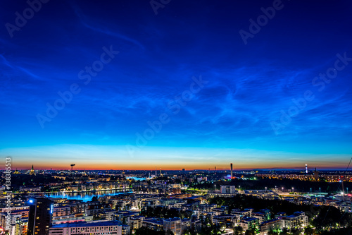 Nattlysande moln (Noctilucent clouds -NLC) över Stockholm en sommarkväll när solen gått ner (2 av 3) photo