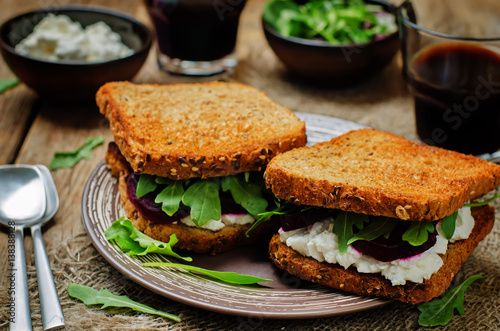 Roasted beet ricotta arugula rye sandwich