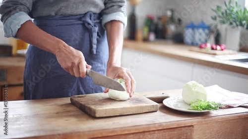 Woman cutting fennel bulb