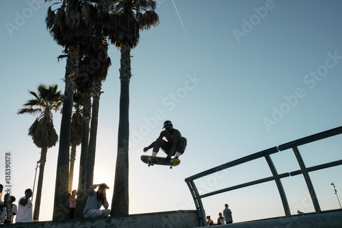 Skateboarder in mid air doing skateboard trick
