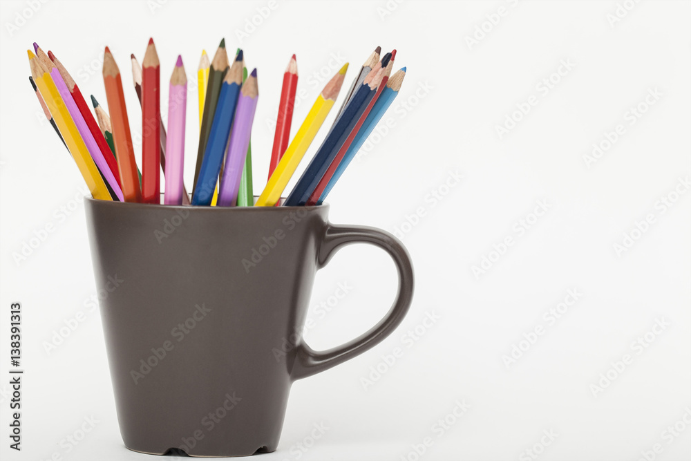 colored pencils in a brown circle on a white background colored pencils in a brown circle on a white background