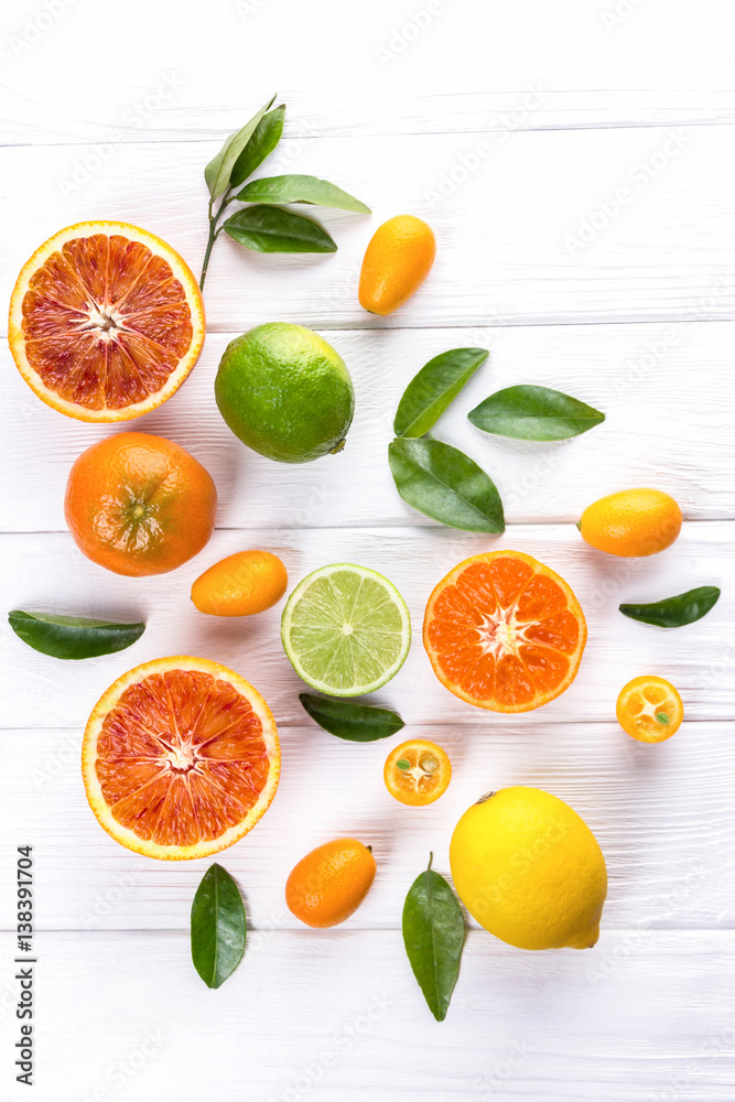 Fresh citrus fruits with leaves. Sicilian oranges, lemon, mandarin, lime, kumquat Fresh citrus fruits with leaves. Sicilian oranges, lemon, mandarin, lime, kumquat