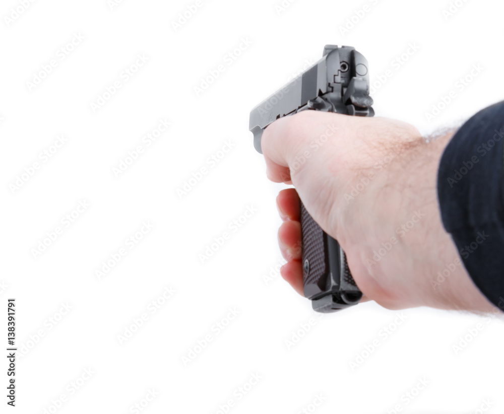 Hand holding pistol handgun isolated on white background Hand holding pistol handgun isolated on white background