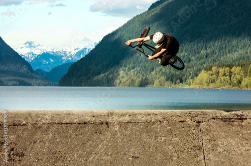 Man performing stunt on bike, Golden Ears Provincial Park, Canada 