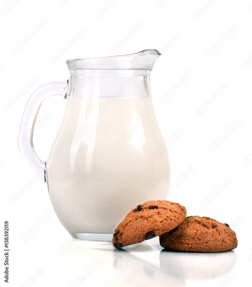 jug of milk with oatmeal cookies isolated on white background jug of milk with oatmeal cookies isolated on white background