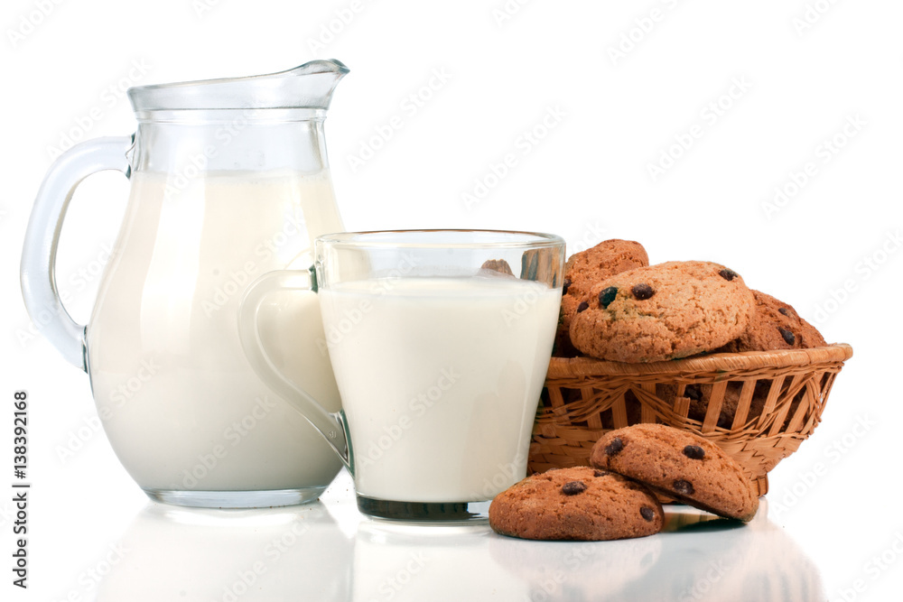 jug and glass of milk with oatmeal cookies in a wicker basket isolated on white background jug and glass of milk with oatmeal cookies in a wicker basket isolated on white background