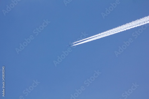 Airplane on the blue sky.  © venars.original