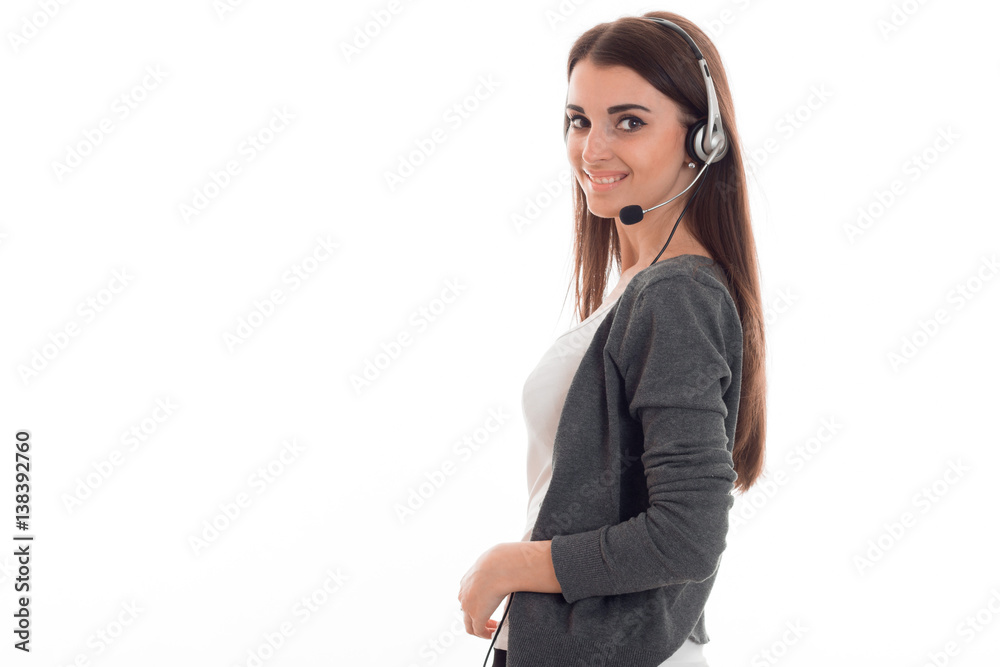 young happy business woman in uniform with headphones and microphone looking at the camera and smiling isolated on white background young happy business woman in uniform with headphones and microphone looking at the camera and smiling isolated on white background