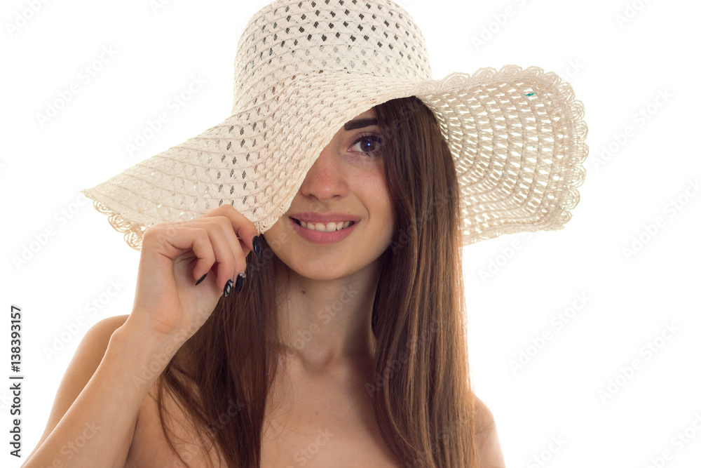 portrait of young pretty brown hair woman in straw hat with wide brime looking and smiling on camera isolated on white background portrait of young pretty brown hair woman in straw hat with wide brime looking and smiling on camera isolated on white background