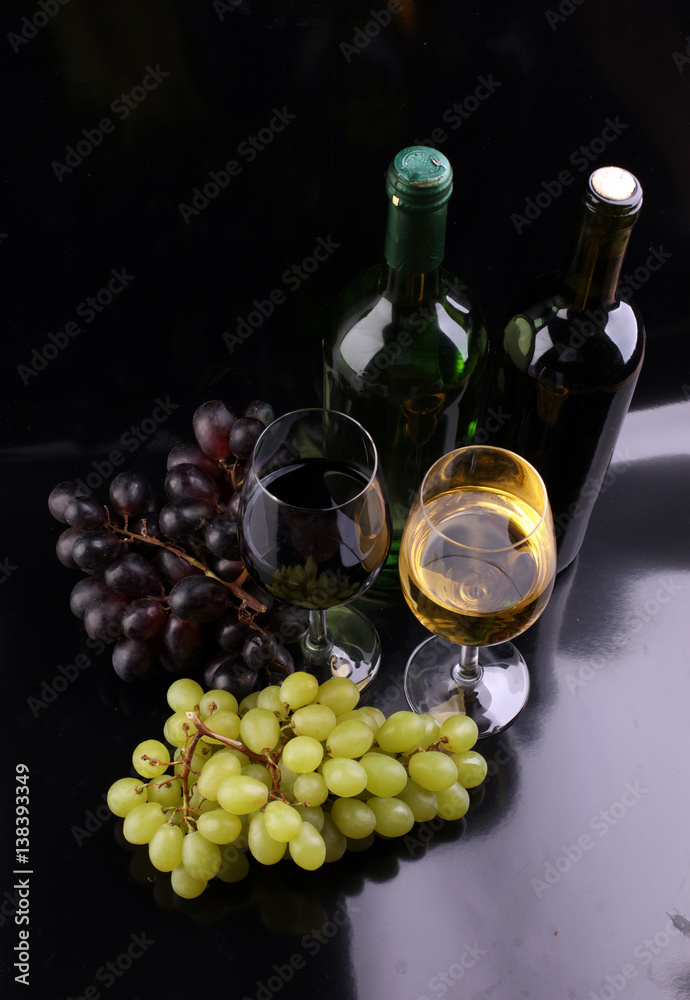 Fototapeta premium Wine glass and Bottle on black background. Red and white wine