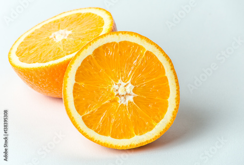 Fresh orange fruit in a cut  macro close up photo. Healthy and natural food 