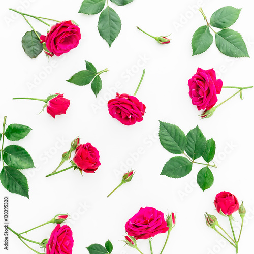 Floral pattern with red roses on white background. Flat lay  top view. Floral background