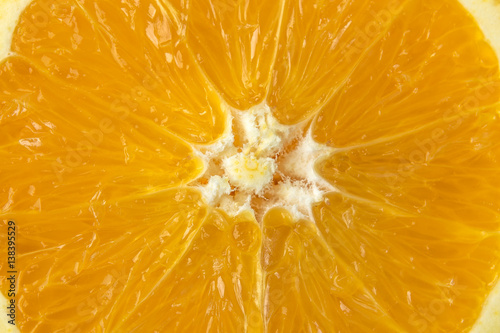 Fresh orange fruit in a cut, macro close up photo. Healthy and natural food 