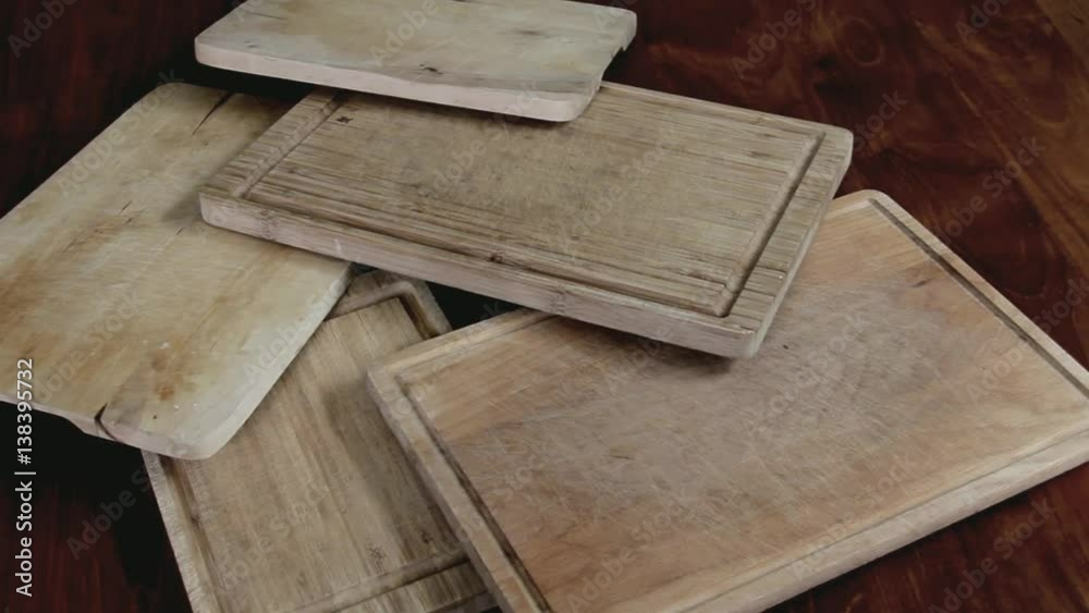 Old Handmade Cutting Boards on the Wooden Table. Camera Moves Left Old Handmade Cutting Boards on the Wooden Table. Camera Moves Left