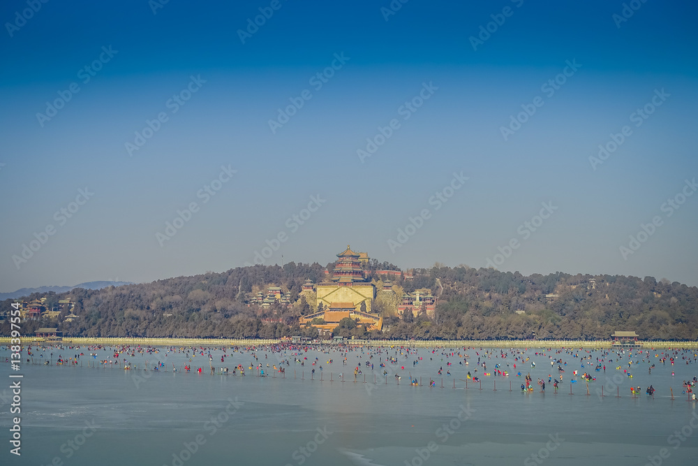 BEIJING, CHINA - 29 JANUARY, 2017: Walking around spring palace complex, a spectacular ensemble of lakes, gardens and ancient chinese palaces, beautiful buildings and architecture