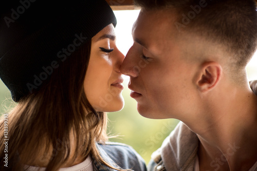 Kissing couple, close-up portrait of man and woman. Kiss, love and relationship of boy and girl