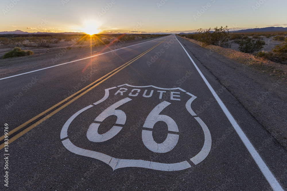 Route 66 highway sign sunset in the California Mojave Desert.  