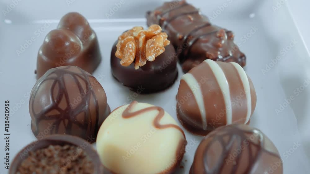 Pralines and chocolates - a variety of sweets Pralines and chocolates - a variety of sweets
