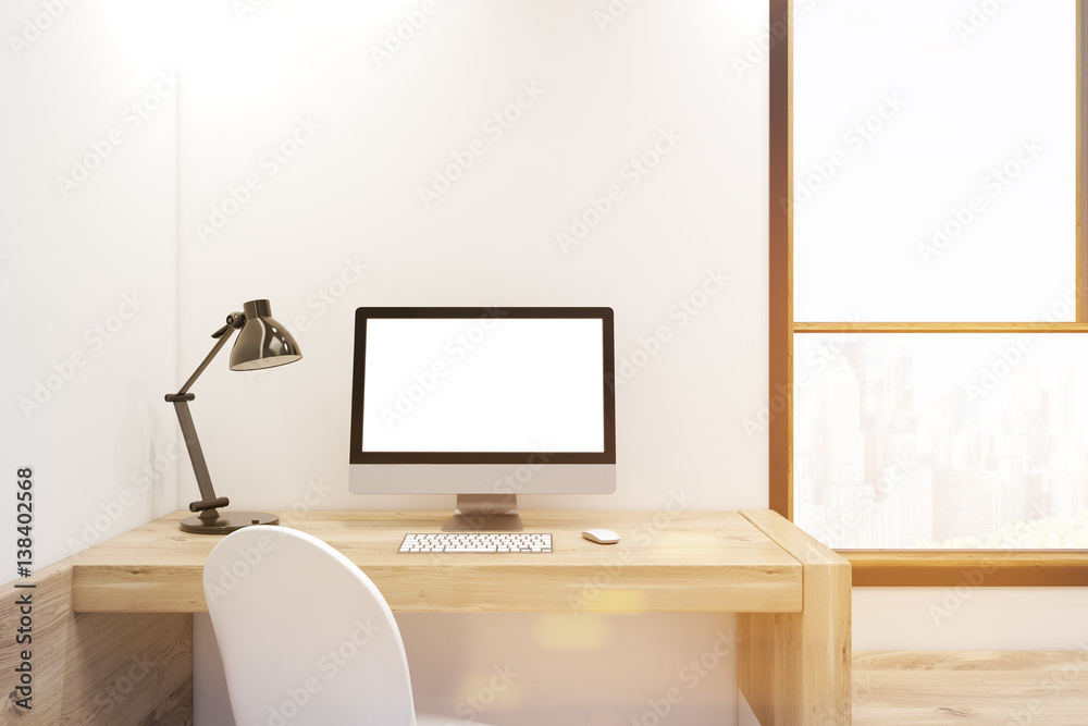White computer screen on wooden desk, toned White computer screen on wooden desk, toned