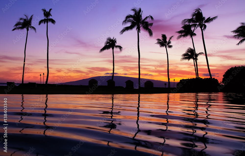 Purple hawaiian sunset over pool