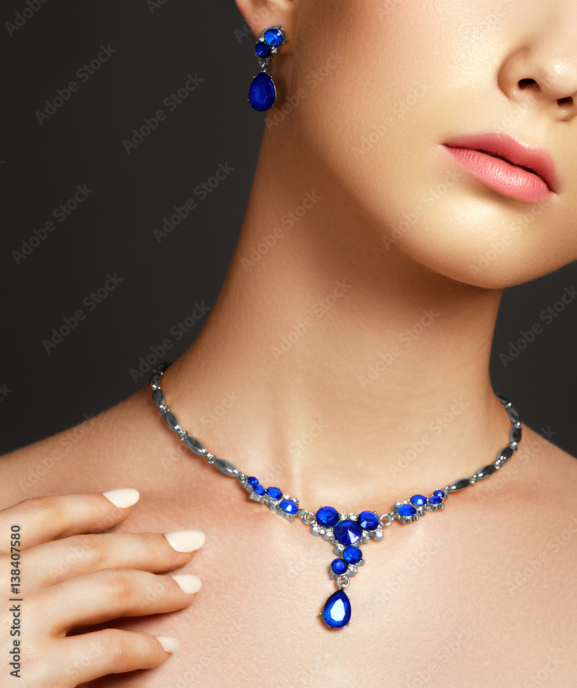 Jewellery and accessories. Elegant fashionable woman with jewelry. Beautiful woman with sapphire necklace. Young beauty model with sapphire pendant. Fashion and beauty salon. Perfect lip makeup