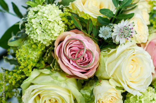 wedding bouquet with roses and rings