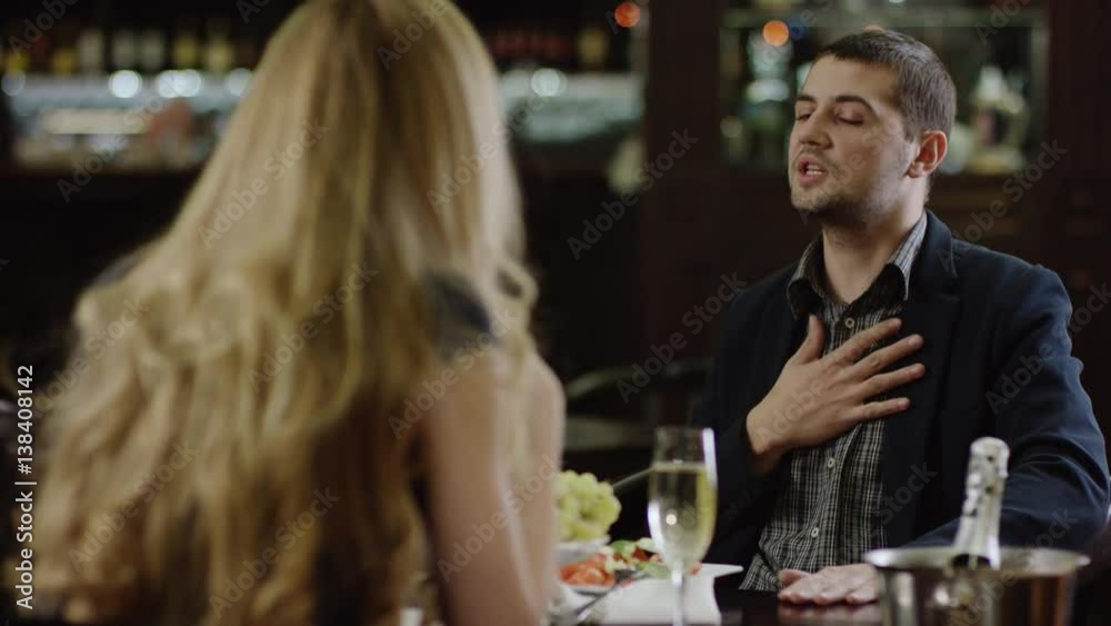 woman arguing with man in restaurant woman arguing with man in restaurant