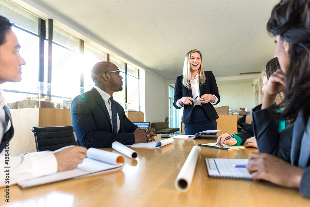 Diverse coed multiethnic professional group at company business meeting Diverse coed multiethnic professional group at company business meeting