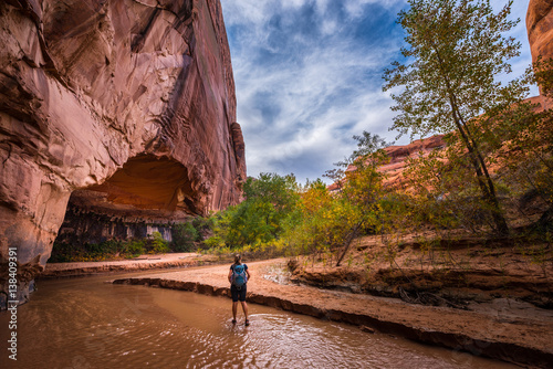 Backpacker Girl exploring Coyote Gulch Grand Staircase Escalante National Monument photo