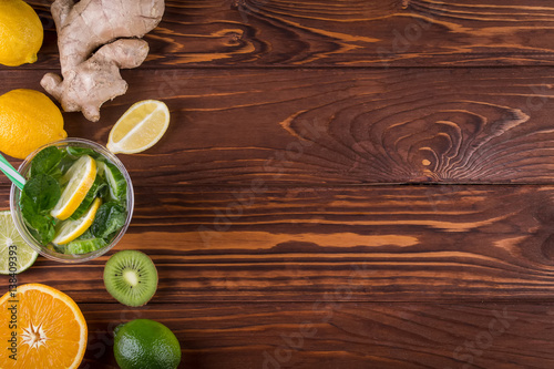 Fresh organic citrus fruits and on wooden background. Healthy food and healthy life concept. Top view