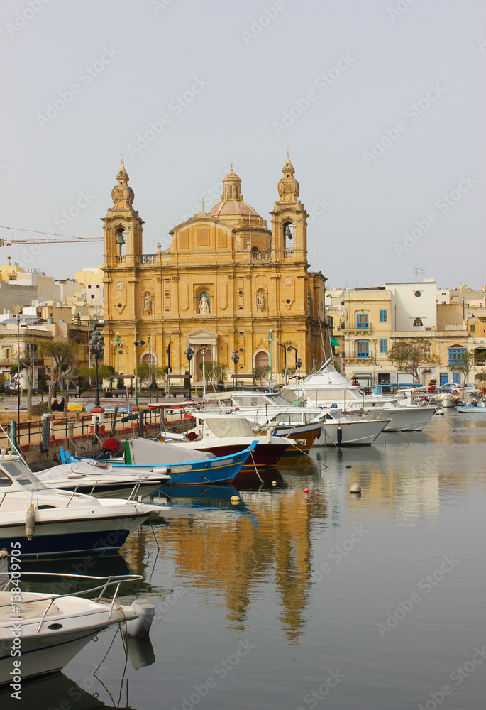 Parish Church at Msida marina with boats on Malta Island. 