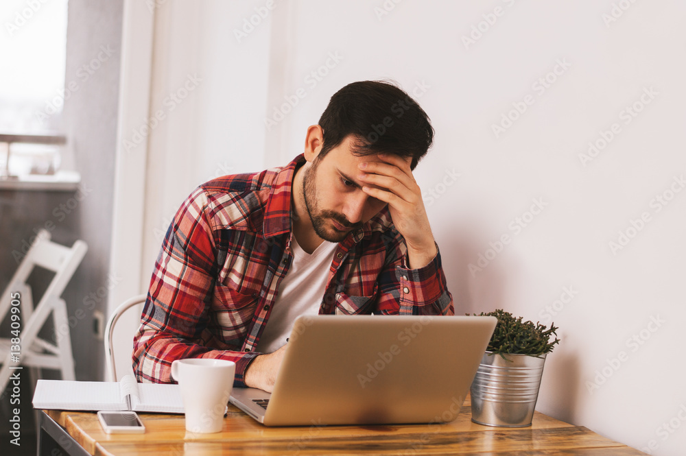 Handsome man having problems with project Handsome man having problems with project