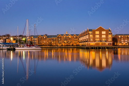Buildings on the Canton Waterfront at twilight, in Baltimore, Maryland.
