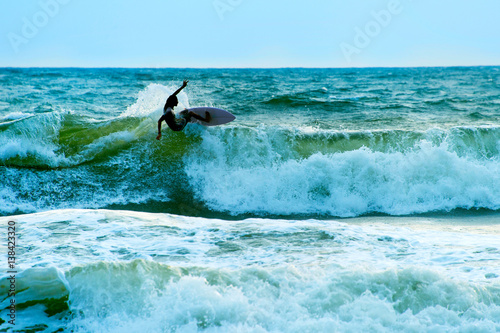 Surfer in the ocean. Bali