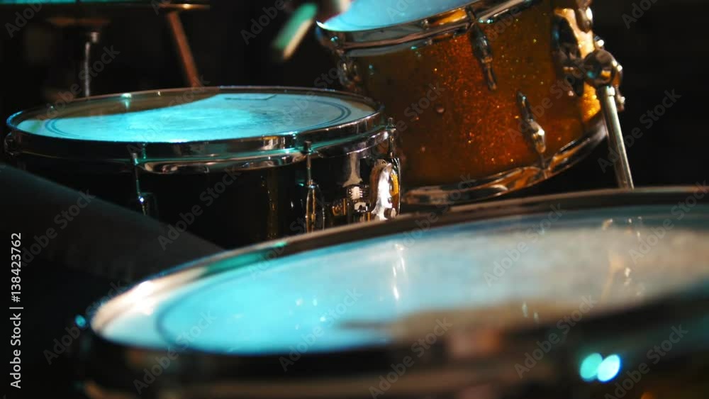 Concert rock band performing - drummer, close up Concert rock band performing - drummer, close up