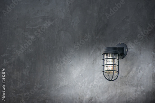 a lamp on modern wall one lamp on cement background dark tone.