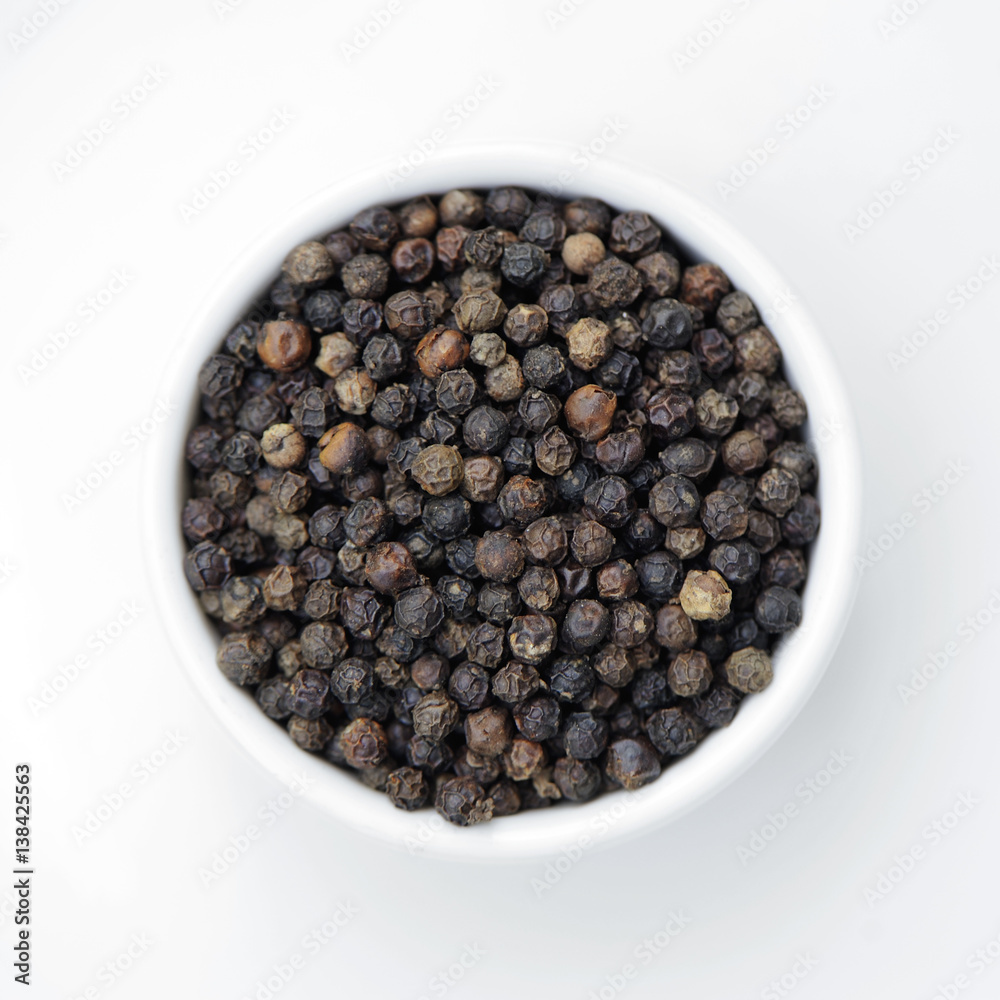 Black pepper was placed isolate is on a white background Black pepper was placed isolate is on a white background