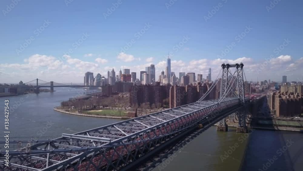 flying backwards alongside Williamsburg Bridge with NYC in background day flying backwards alongside Williamsburg Bridge with NYC in background day