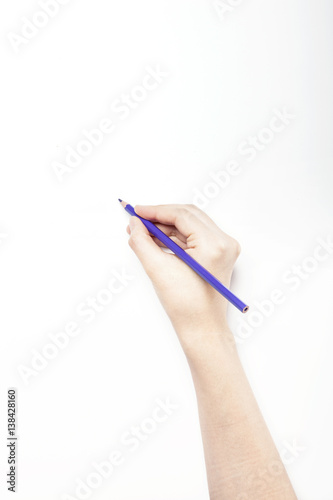 A woman hand hold a purple color pencils isolated white.