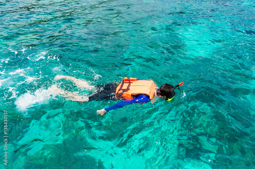 Tourist Snorkeling on Lipe island, Thailand.
