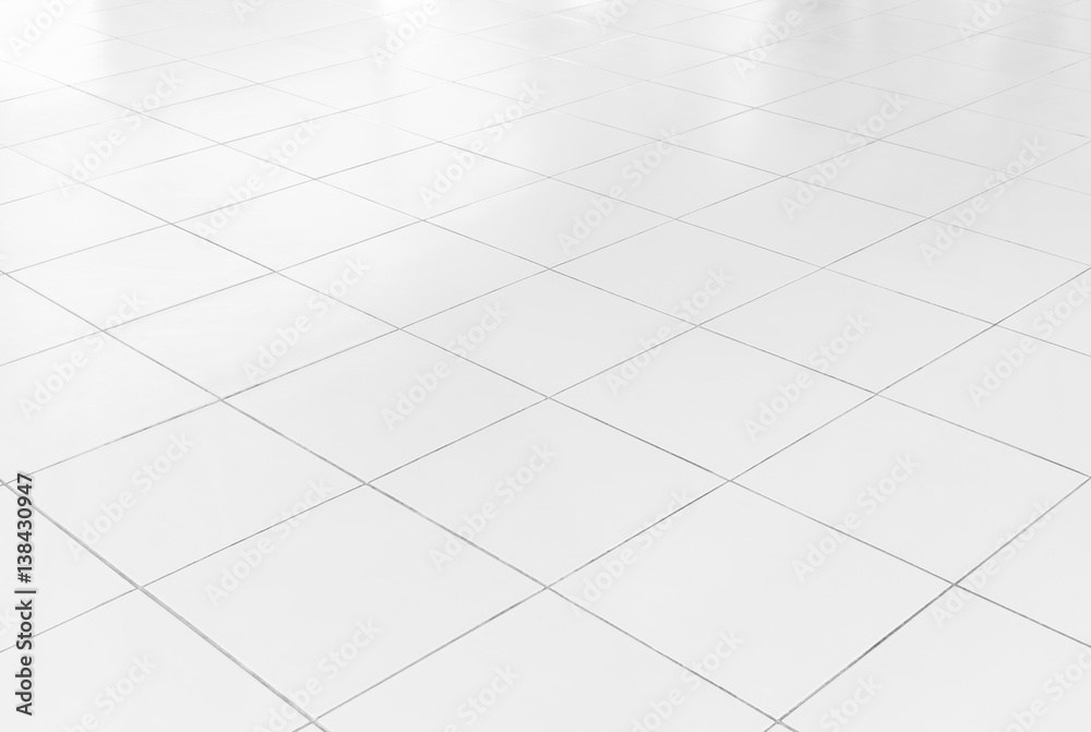White tile floor background in perspective view. Clean, shiny, symmetry with grid line texture. For decoration in bathroom, kitchen and laundry room. And empty or copy space for product display also. White tile floor background in perspective view. Clean, shiny, symmetry with grid line texture. For decoration in bathroom, kitchen and laundry room. And empty or copy space for product display also.