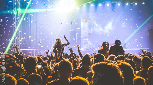 Young people dancing at night club - Hands up and multicolored confetti at nightclub after party - Nightlife concept with afterparty crowd celebrating dj concert festival event - Retro contrast filter