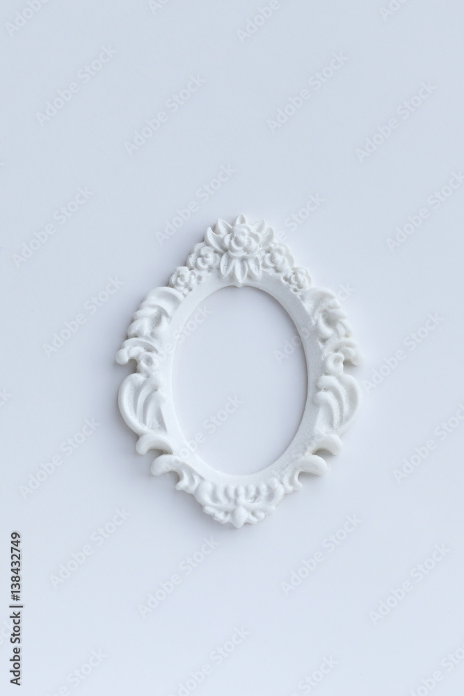 small white decorative frame on abstract white background. flat lay. copy space. template for design small white decorative frame on abstract white background. flat lay. copy space. template for design