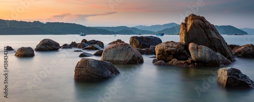 A rocky coastline at sunset looking out over the south China sea in Vung Lam Bay Vietnam.