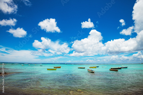 Landscape of crystal ocean with fishing boats in sunny day. Tropical island view. Summer vacation. photo