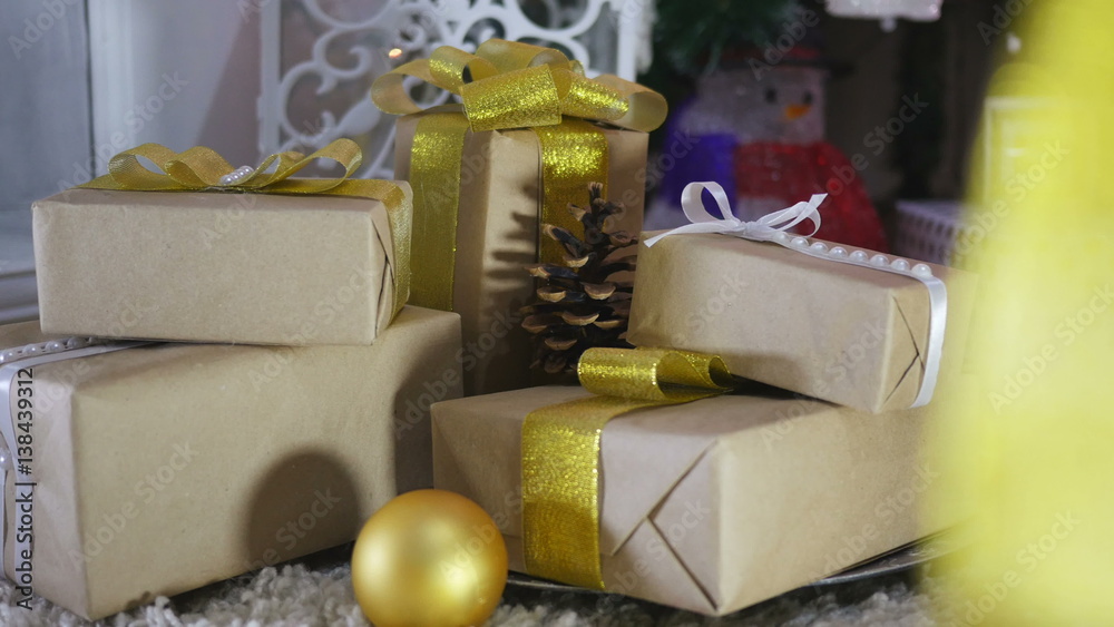Presents under the Christmas tree on floor Presents under the Christmas tree on floor