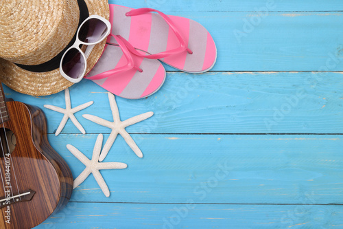 Summer holiday background, Beach accessories on  wood table, Vacation and travel items, Red flip flop with sunglasses on wood table