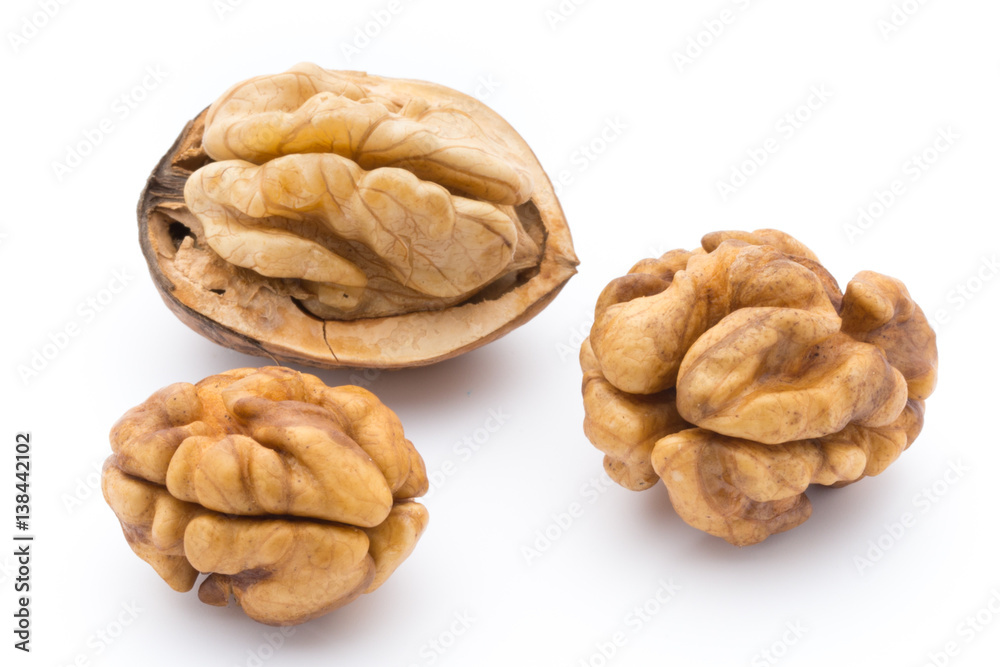 Walnut and walnut kernel isolated on the white background. Walnut and walnut kernel isolated on the white background.